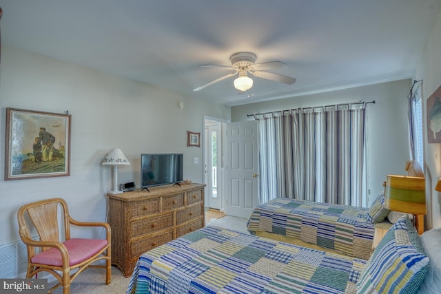 carpeted bedroom featuring ceiling fan