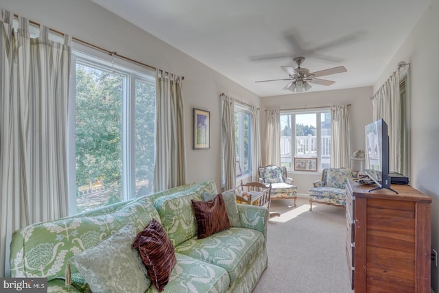 interior space featuring ceiling fan and a wealth of natural light