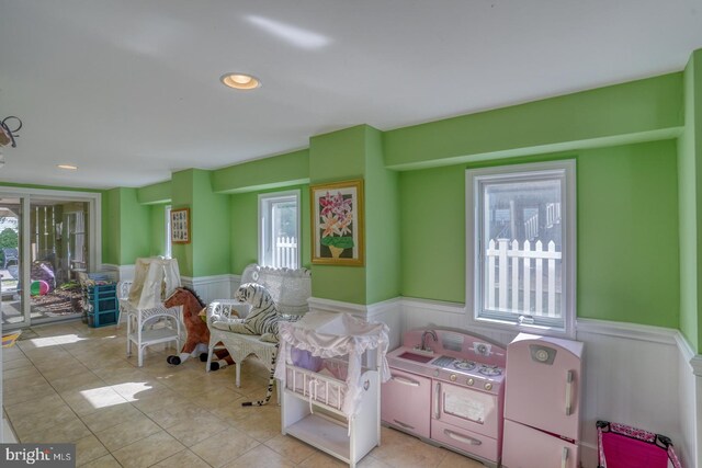 interior space featuring washer / clothes dryer and light tile patterned floors