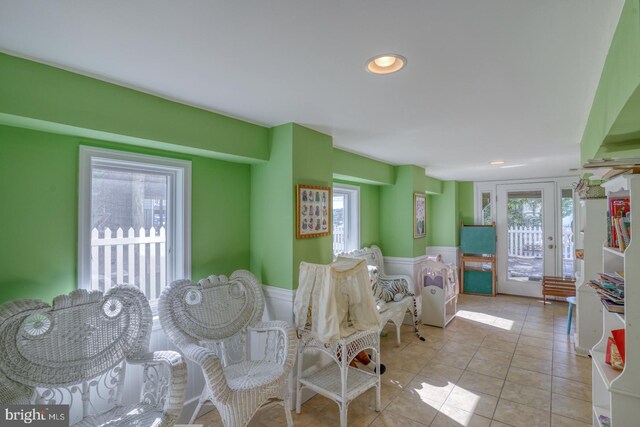 interior space with light tile patterned floors and a wealth of natural light