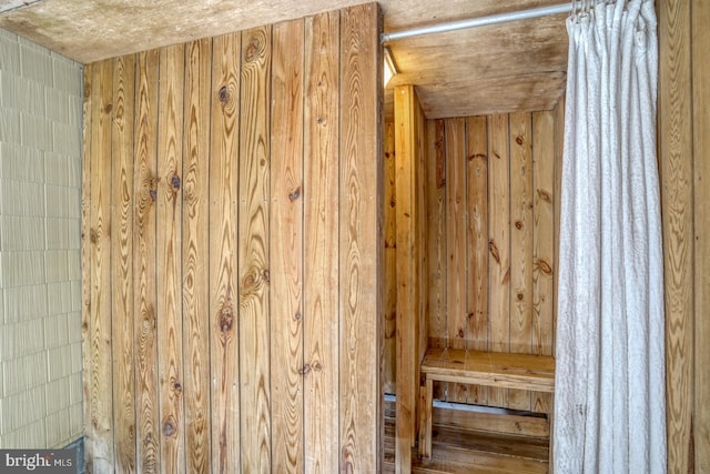 view of sauna with wooden walls