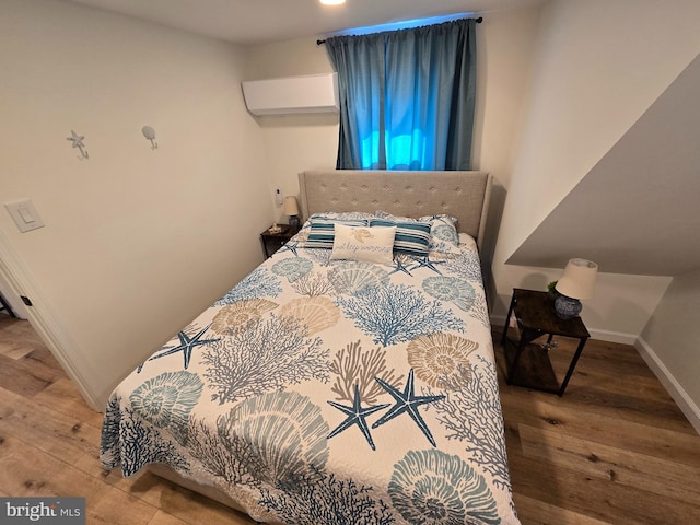 bedroom featuring hardwood / wood-style flooring