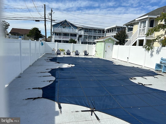 view of swimming pool featuring a patio