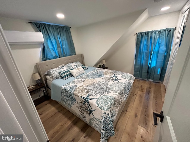 bedroom with hardwood / wood-style flooring