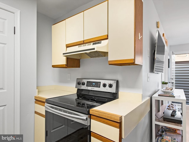 kitchen featuring hardwood / wood-style floors and electric range