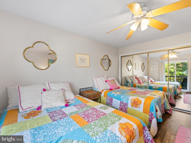 bedroom with a closet, hardwood / wood-style flooring, and ceiling fan