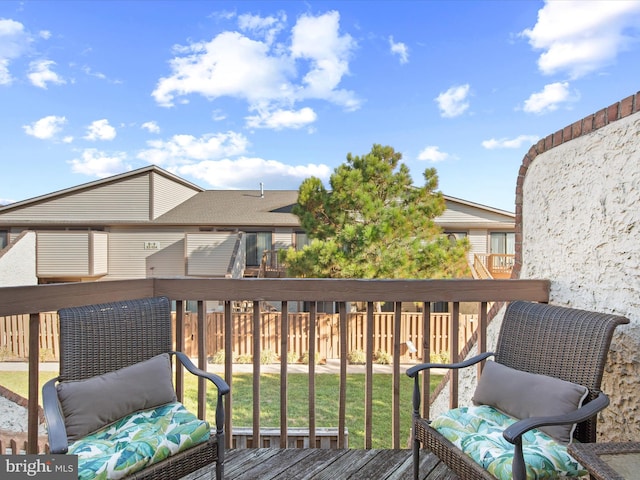 deck featuring outdoor lounge area and a yard