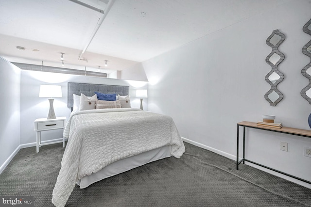 bedroom featuring dark carpet