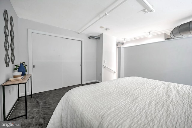 carpeted bedroom with a closet