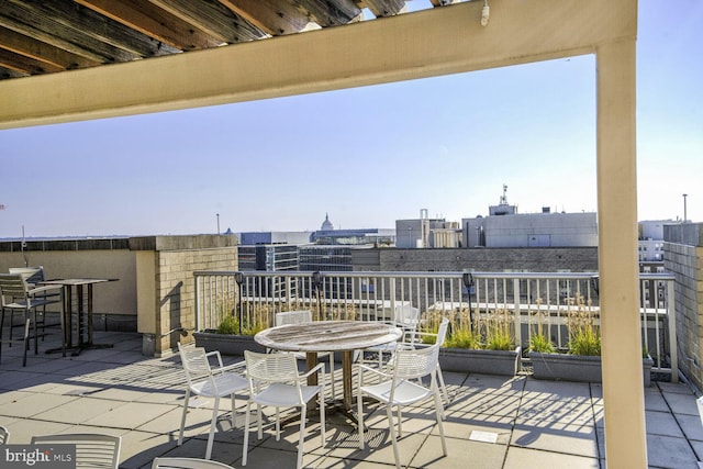 view of patio featuring a balcony