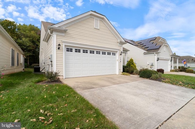 view of front facade featuring a front lawn, central AC unit, and a garage