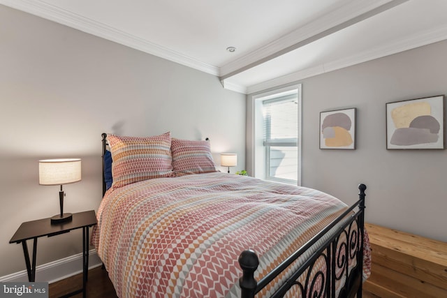 bedroom featuring dark hardwood / wood-style floors and crown molding