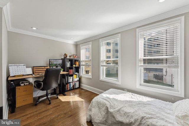 bedroom featuring ornamental molding and dark hardwood / wood-style flooring