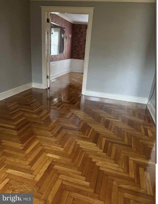 unfurnished room with dark parquet flooring