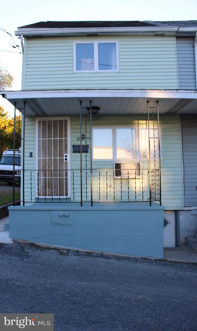 view of property exterior featuring a porch