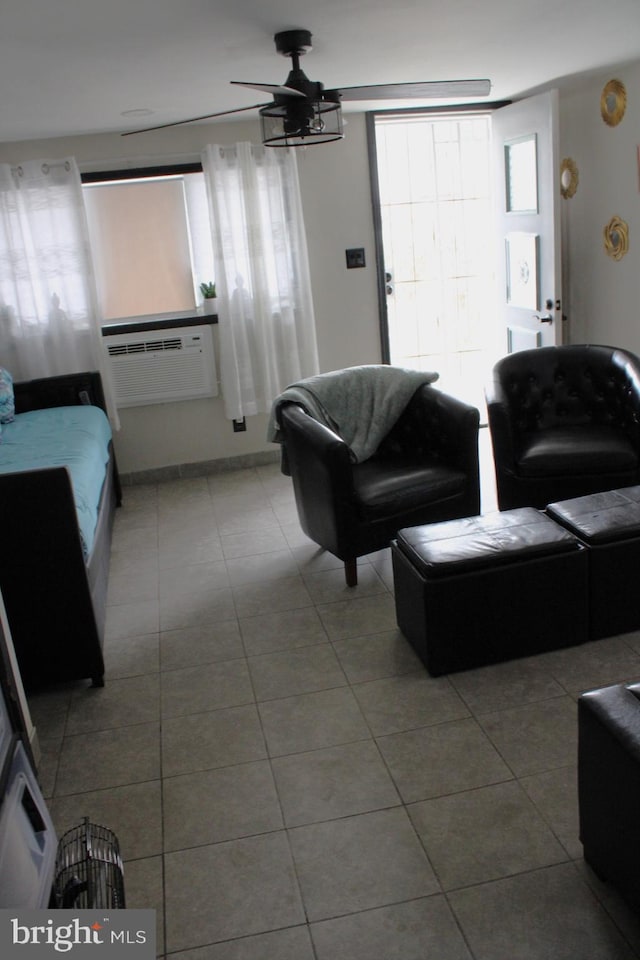 living room with cooling unit and light tile patterned floors