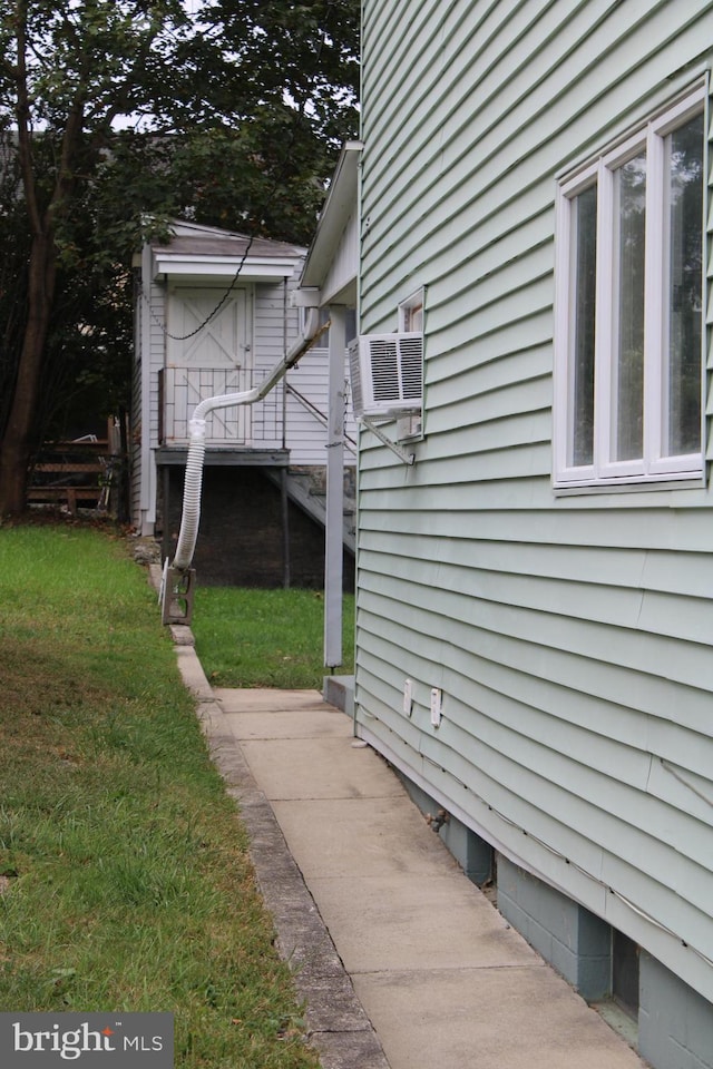 view of home's exterior featuring a lawn