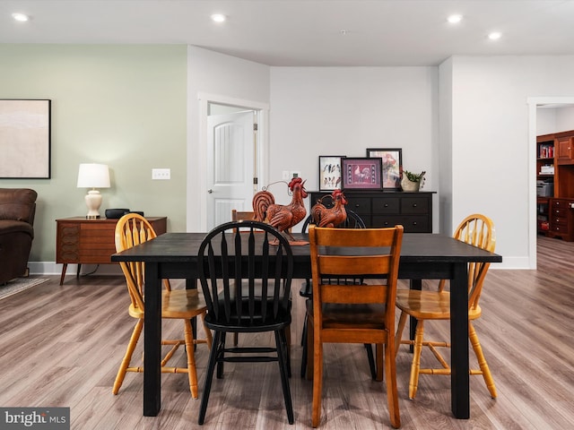 dining space featuring hardwood / wood-style flooring