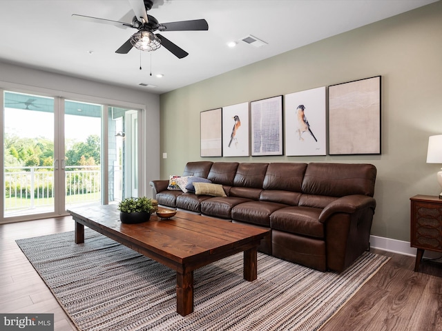 living room with ceiling fan and hardwood / wood-style floors