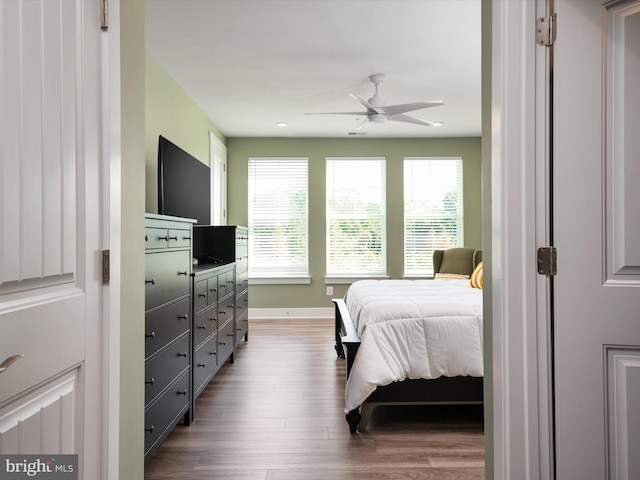 bedroom featuring wood-type flooring and ceiling fan