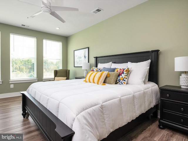 bedroom featuring ceiling fan and dark hardwood / wood-style floors