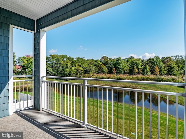 balcony featuring a water view