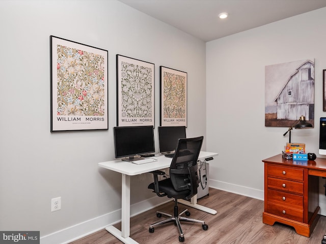 office space with hardwood / wood-style floors