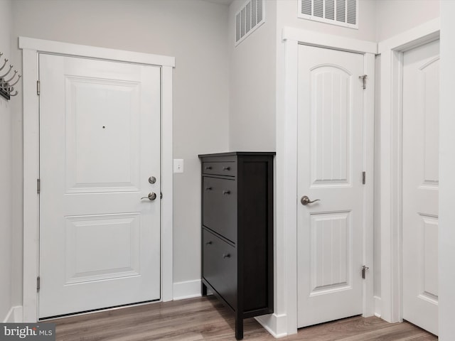 doorway to outside featuring light hardwood / wood-style flooring