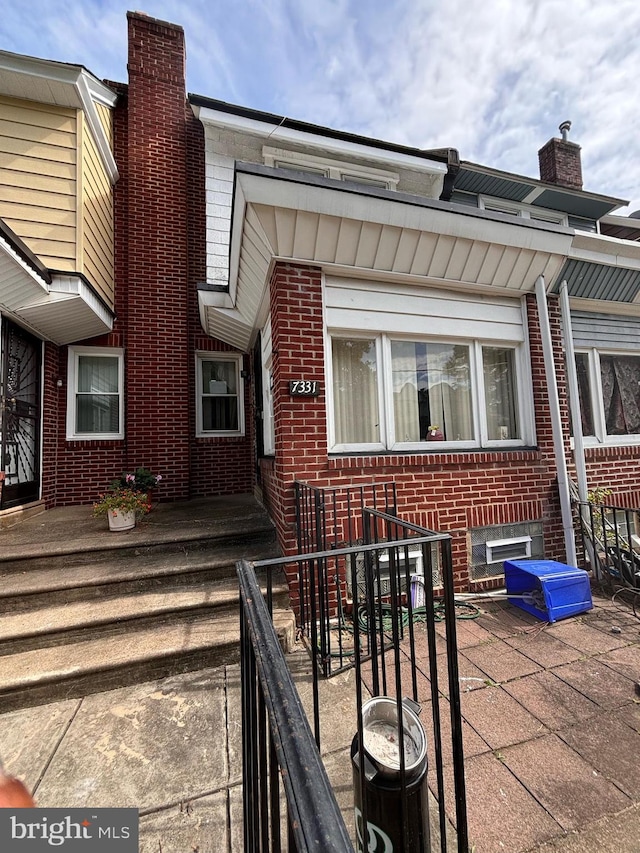 entrance to property with a patio area