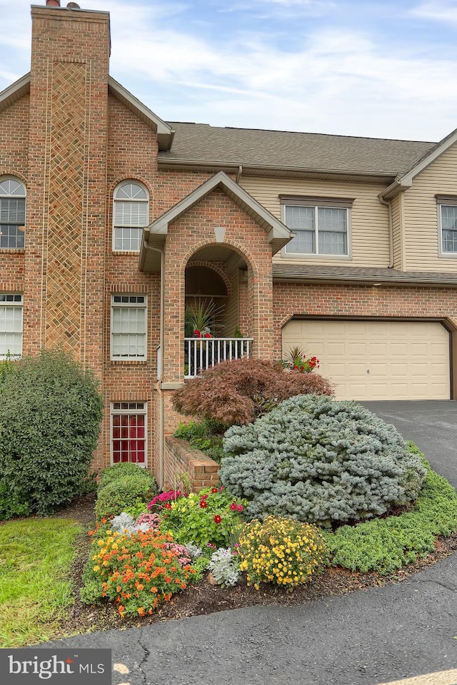 multi unit property featuring a garage