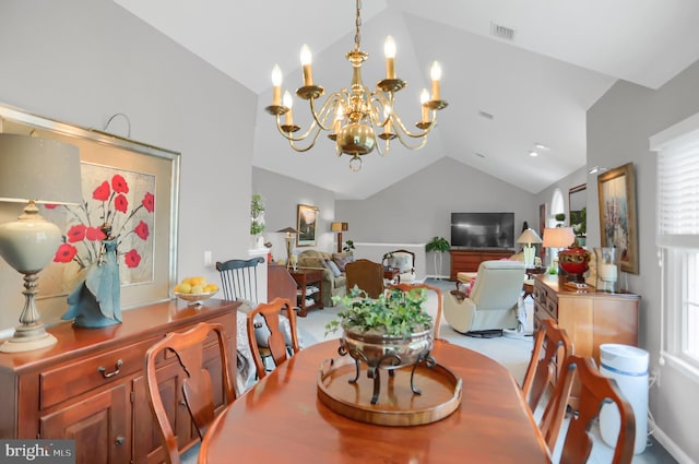 dining room featuring vaulted ceiling