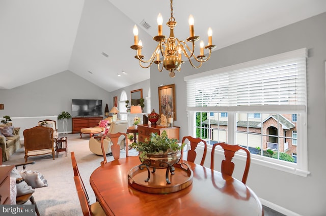 dining space featuring carpet flooring, an inviting chandelier, and vaulted ceiling