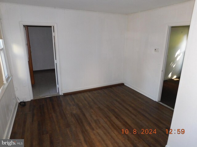 spare room featuring dark hardwood / wood-style floors