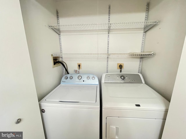 laundry room featuring washing machine and dryer