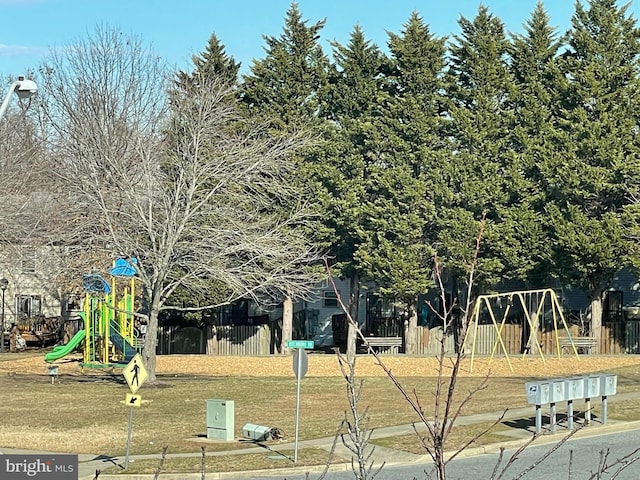 view of playground with a yard