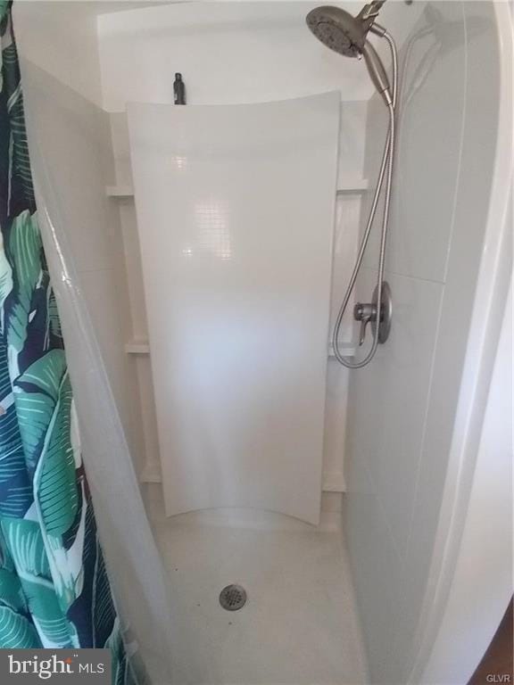 bathroom with a shower stall