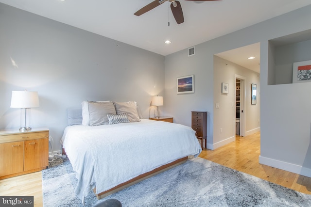 bedroom featuring ceiling fan and light hardwood / wood-style flooring