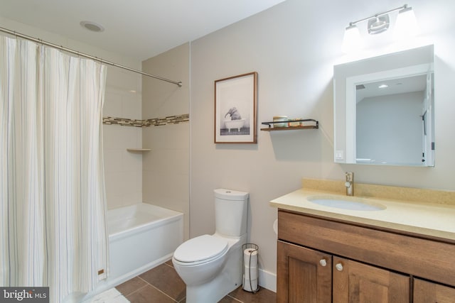 full bathroom with shower / tub combo with curtain, tile patterned floors, vanity, and toilet