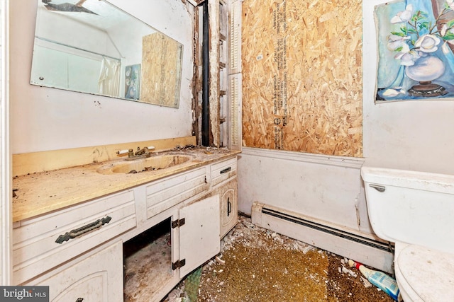 bathroom with vanity, toilet, and a baseboard radiator