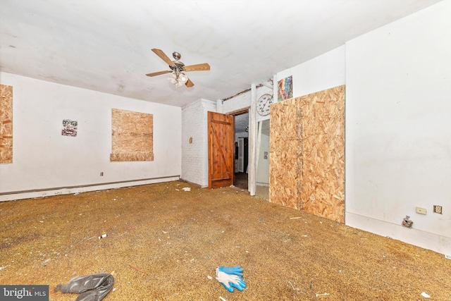 spare room featuring baseboard heating and ceiling fan