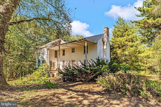 6753 Dickerson Rd, Dickerson, MD 20842 - view of side of property with a chimney and brick siding