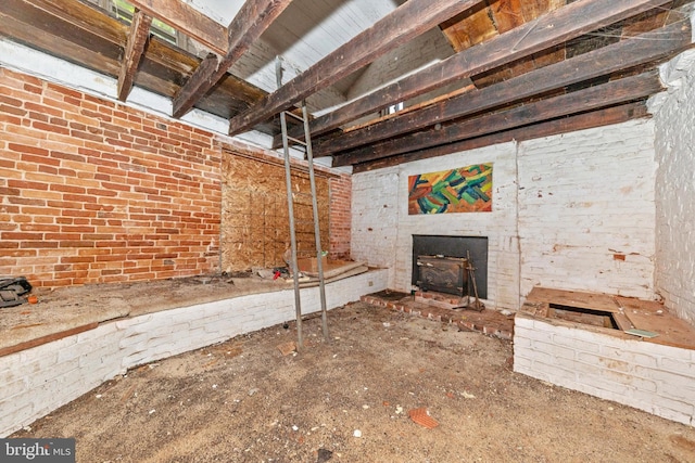 unfurnished living room with a wood stove