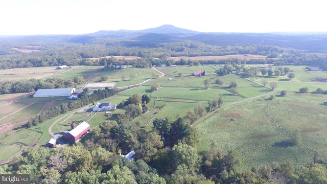 birds eye view of property with a mountain view and a rural view