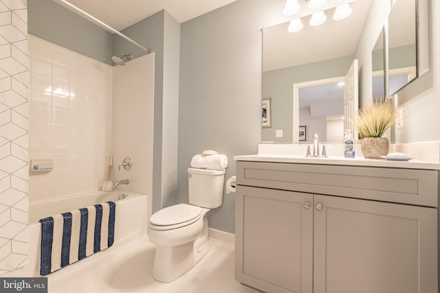 full bathroom featuring toilet, tiled shower / bath, vanity, and tile patterned flooring