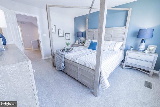 bedroom featuring light carpet