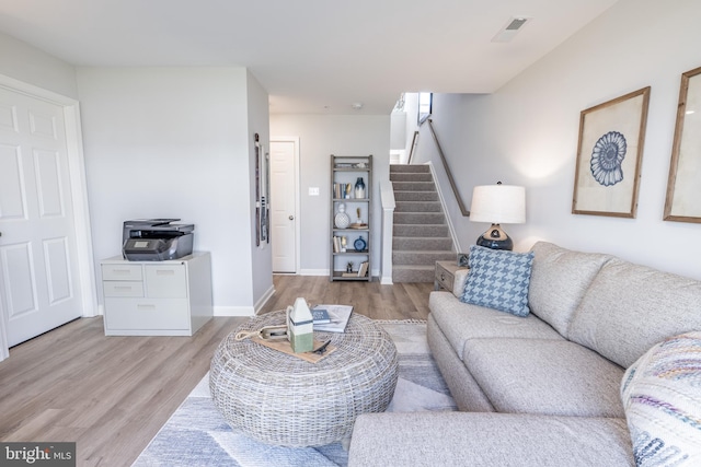 living room with light hardwood / wood-style flooring