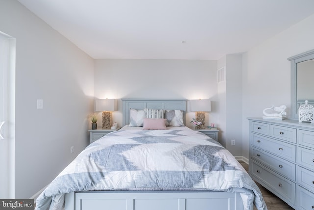 bedroom featuring wood-type flooring