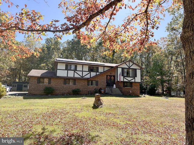 tudor house featuring a front lawn