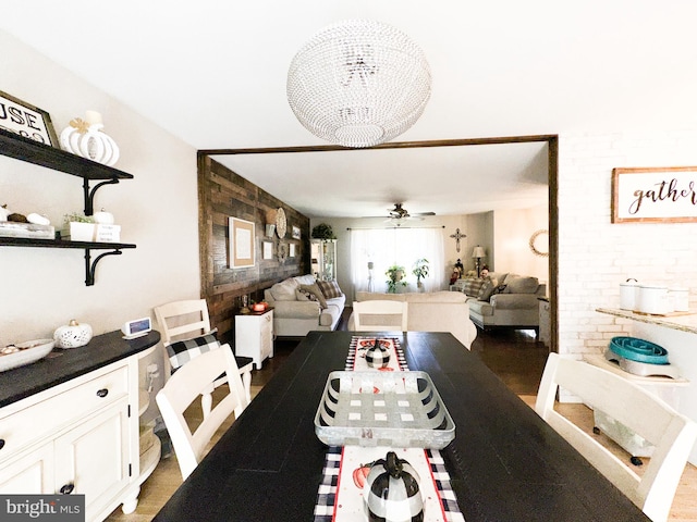 dining room with ceiling fan and hardwood / wood-style flooring