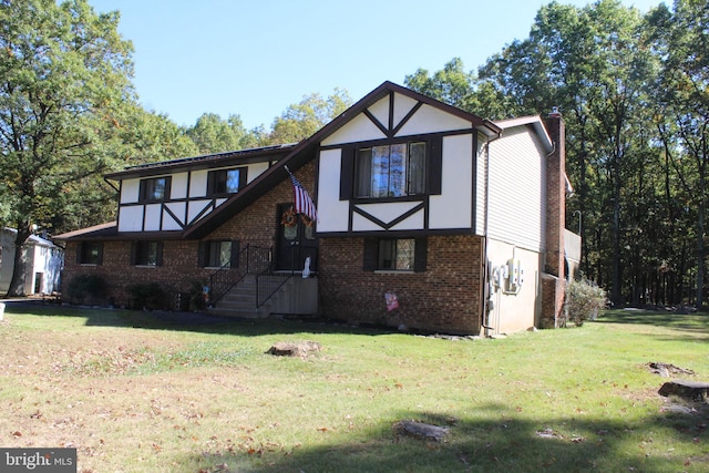 tudor home featuring a front yard